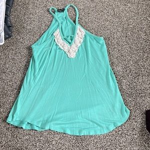 a cute teal tank top. size xs. only worn once.